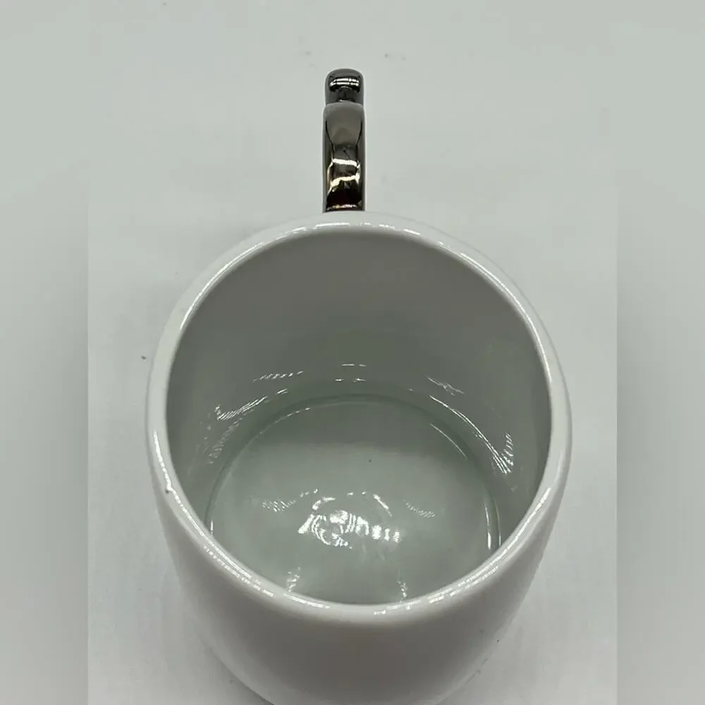 Brass knuckles coffee mug white and silver
